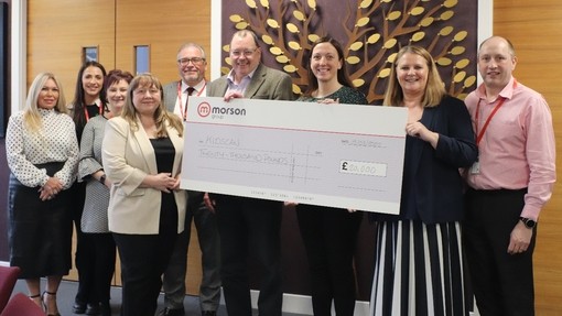 Morson Charity committee holding a big cheque