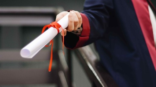 Person holding their degree