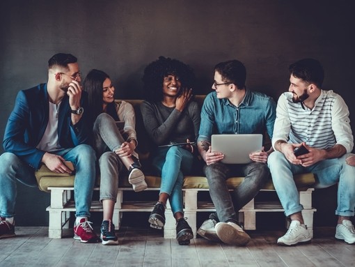 A group of people sitting on a bench