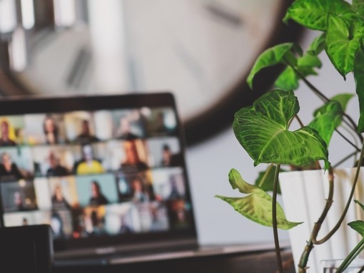 Laptop with a video call meeting on screen