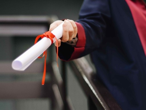 Person holding their degree