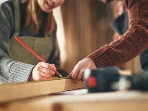 A joiner marking a piece of wood