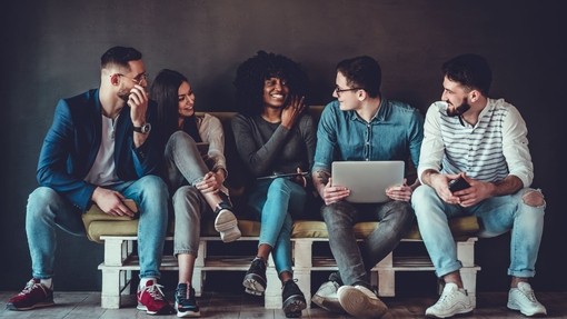 A group of people sitting on a bench