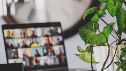 Laptop with a video call meeting on screen