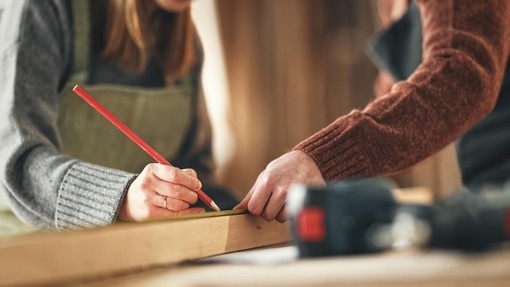 A joiner marking a piece of wood