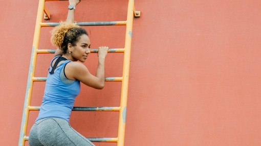 Woman climbing a "corporate ladder"