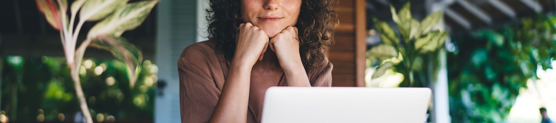 Woman sat at a desk with a laptop