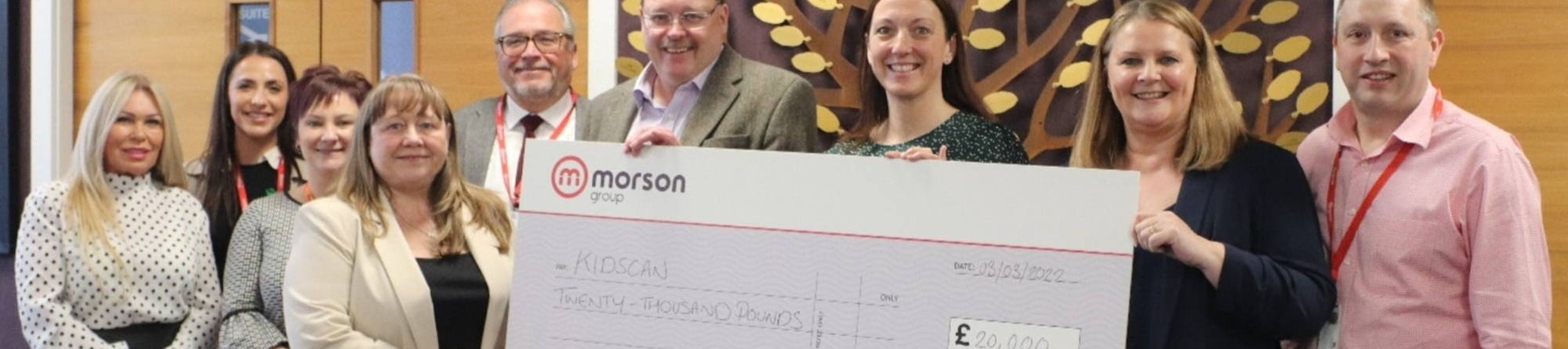 Morson Charity committee holding a big cheque