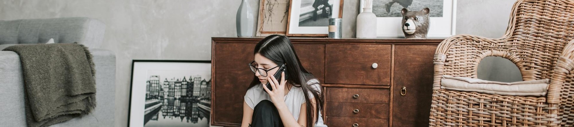 Woman wearing glasses on the phone
