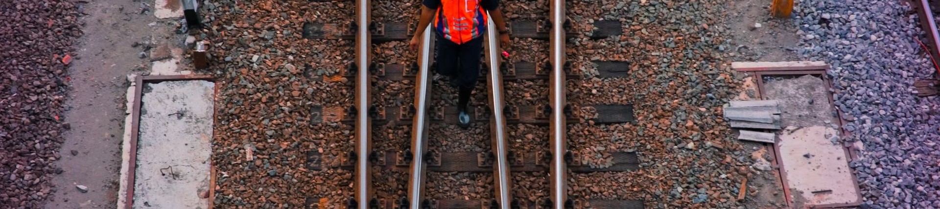 Rail worker on train tracks