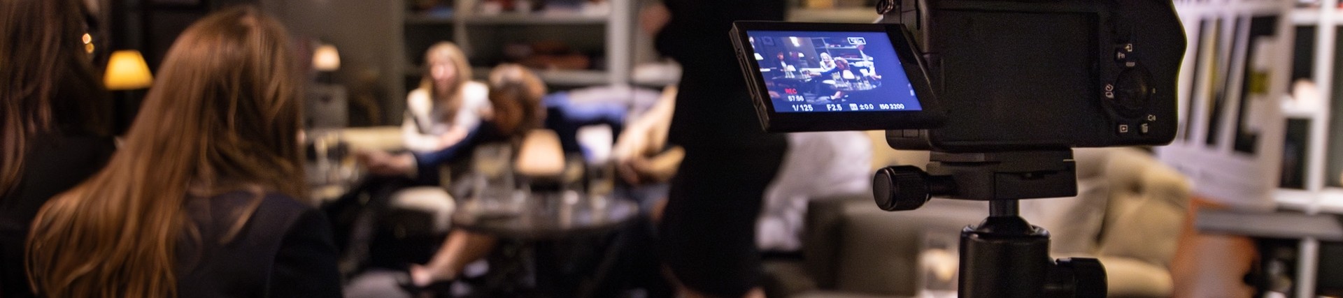 A room full of women on International Women's Day, captured on a camera