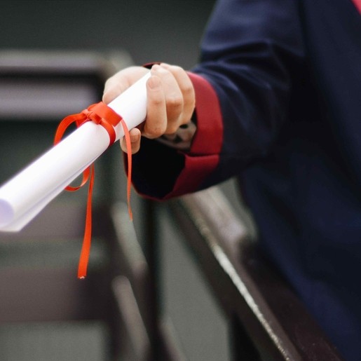 Person holding their degree