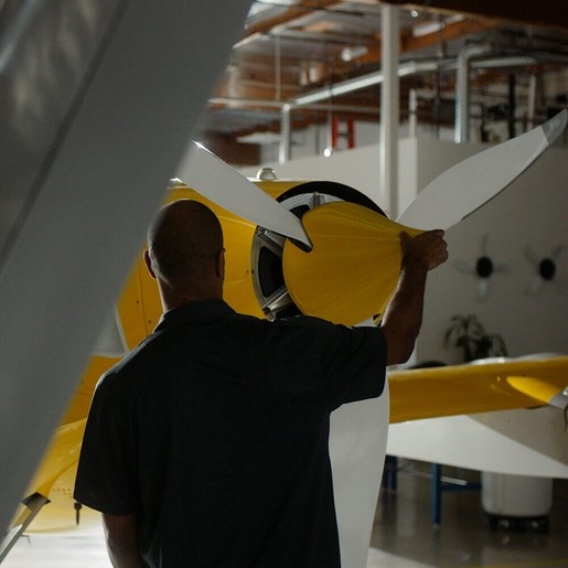 Wisk employee holding propeller